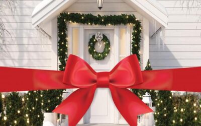 What are the advantages of buying or selling a house during the holiday season?